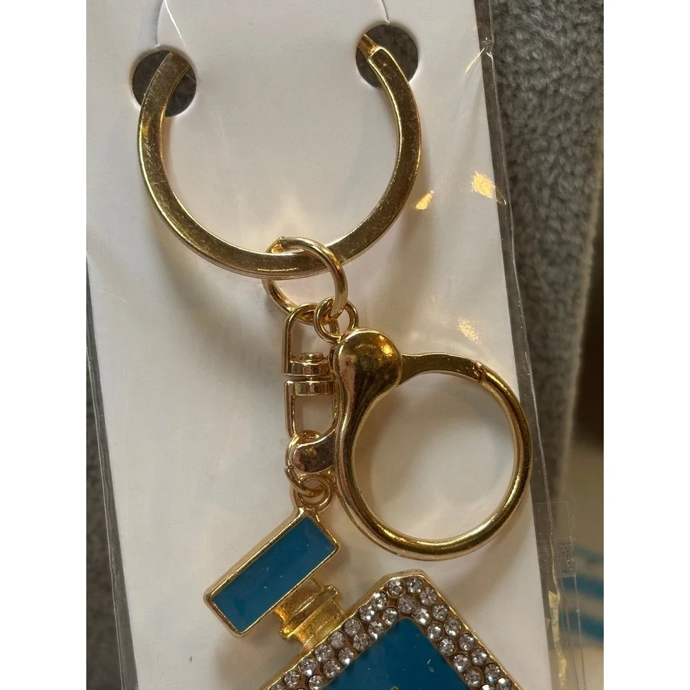 #5. Turquoise bag charm keychain perfume bottle-inspired.
